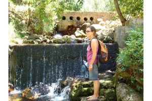 Woman standing near water feature